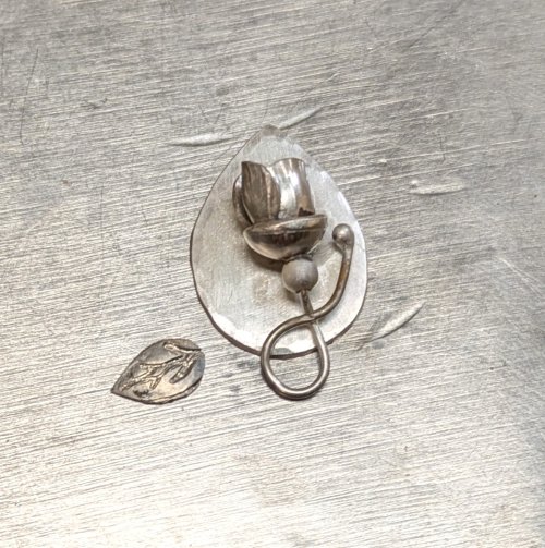 Judy Larson's Hearts and Flowers Charms - , Classic Wire Jewelry, Cutting, Cutting Tool, Cutters, Filing, Finishing, Butane Torch, Soldering, Solder, Design, Place the backing on a soldering surface.